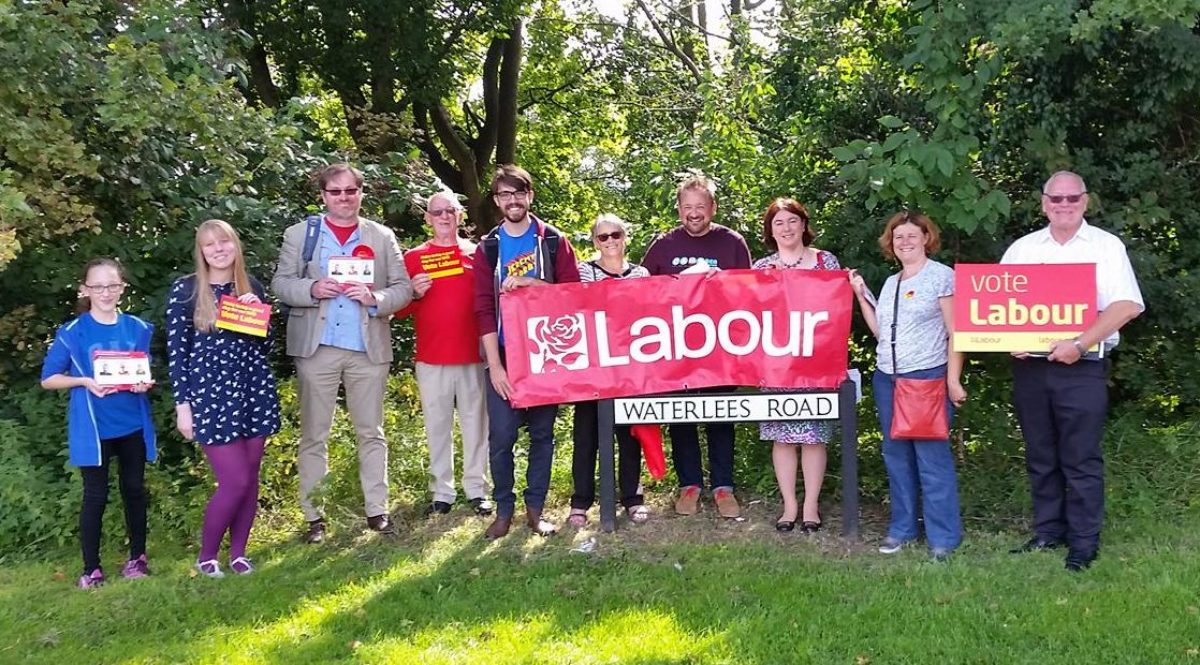 A picture of North East Cambs Labour members out campaigning, holding banners and signs